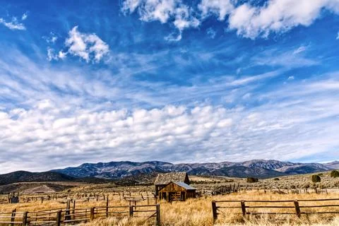 Old Farmhouse Under Cloudy Sky Stock Photos