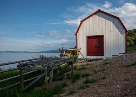 Old-fashioned barn with cod fish drying rack Stock Photos