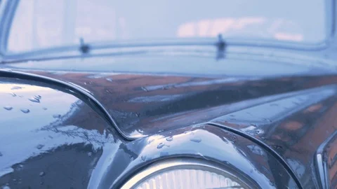Old fashioned black car on the red brick wall Stock Footage 127701049