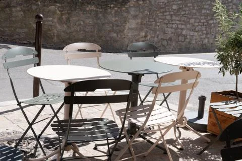Old fashioned cafe table and chairs on the retro bar terrace Stock Photos
