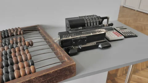 Old Fashioned Calculators Near Adding Machine And Counting Frame Stock Footage 159699421