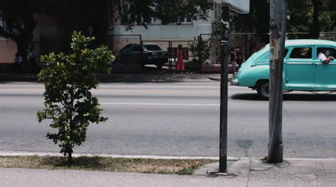 Old fashioned car moving on road Stock Footage 53750469