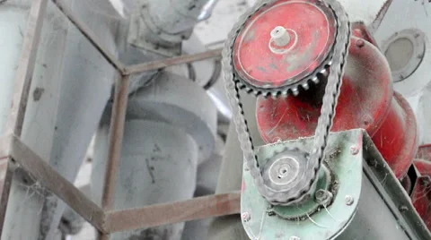 Old fashioned Chain moves around a Gear in Mill Stock Footage 49703091