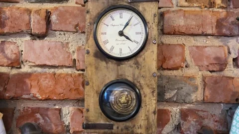 Old Fashioned Clock On Brick Wall. Vintage Timepiece With Rustic Brick Setting Stock Footage 336460626