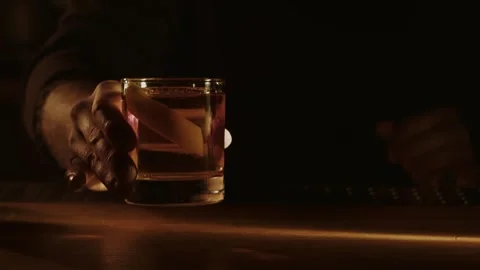 Old fashioned cocktail in hand Stock Footage 263596848