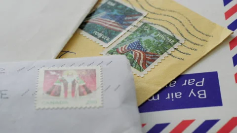 Old fashioned communication. Slider shot over a stack of a paper letters Stock Footage 146694435