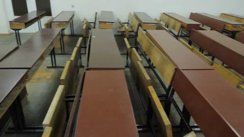 Old-Fashioned Desks In Empty Lecture Hall With Blackboard Video stock 164144939