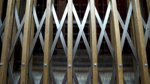 Old fashioned elevator descends. Going down while passing several floors Stock Footage 156442316