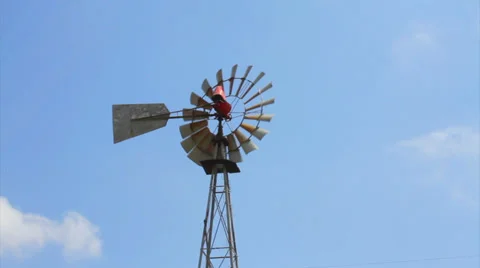 Old-fashioned farmer wind water pump Stock Footage 37333784