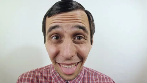 Old-fashioned funny man puts on a glasses Stock Footage 132911440