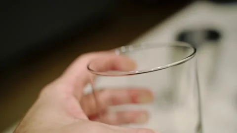An old fashioned glass placed next to a shaker before mixing cocktail Stock Footage 221583644