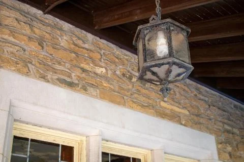 An Old Fashioned Lamp Hanging From the Ceiling of a Balcony at the Elkins Est Stock Photos