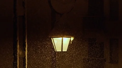 Old Fashioned Lantern street lantern in night heavy snowfall Stock Footage 84792332