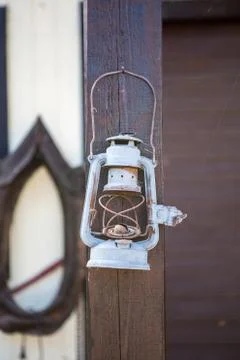 Old-fashioned  lantern on timber background Foto stock