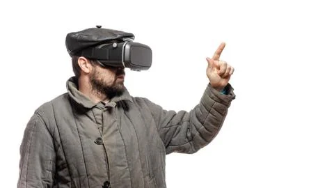 Old fashioned man immersed in virtual reality headset, studio shot, banner wi Stock Photos