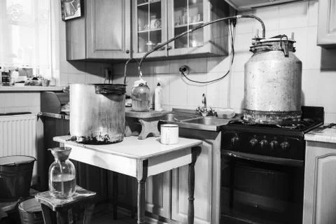 Old-fashioned moonshine machine for creating homemade strong alcohol in the Stock Photos