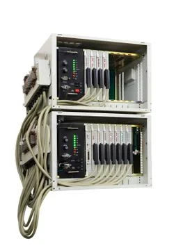 Old fashioned phone switch system without a front door in work. Isolated over Stock Photos