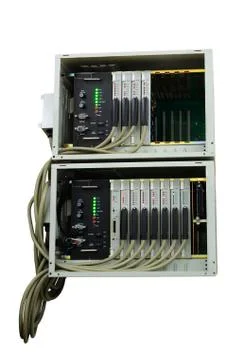 Old fashioned phone switch system without a front door in work. Isolated on w Stock Photos