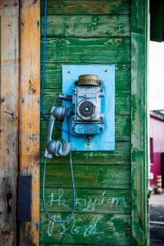 Old fashioned phone on the wall Stock Photos