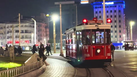 Old-fashioned red tram ride through city. Urban life. Stock Footage 308616702