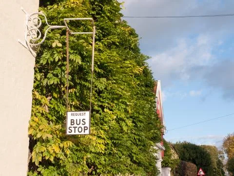 Old fashioned retro request a bus stop sign Stock Photos