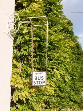 Old fashioned retro request a bus stop sign Stock Photos