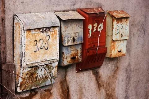 Old-fashioned russian mailboxes on the stucco wall Stock Photos