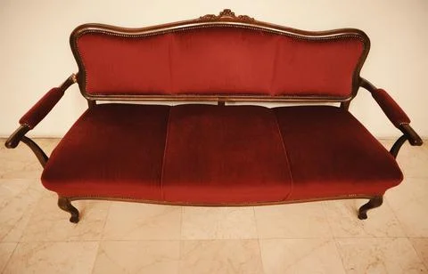 Old-fashioned sofa in the hall Stock Photos