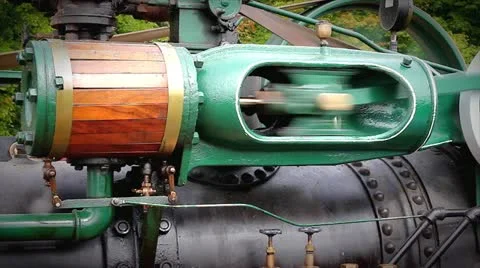 An old-fashioned steam engine  tractor creates power to drive a pony saw mill. Stock Footage 12157128