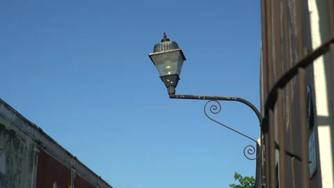 Old Fashioned Street Light On The Red Wall In The Historic Valladolid center Stock Footage 167098270