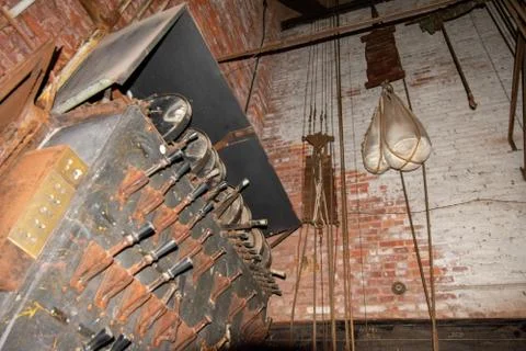 An Old Fashioned Switch Board Full of Rusty Levers With Black Handles in an A Stock Photos