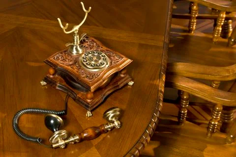 Old-fashioned telephone on table Stock Photos