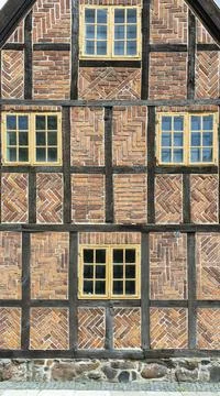 Old fashioned Timber Frame Facade with Classic Bricks pattern in Lund Stock Photos