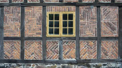 Old fashioned Timber Frame Facade with Classic Bricks pattern in Lund Stock Photos