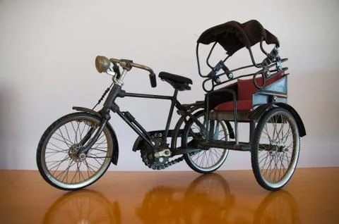 Old-fashioned tricycle model Stock Photos