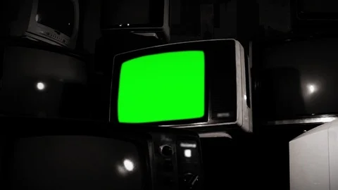Old Fashioned TV with Green Screen with Many Retro TVs. BW Tone. Stock Footage 88481588