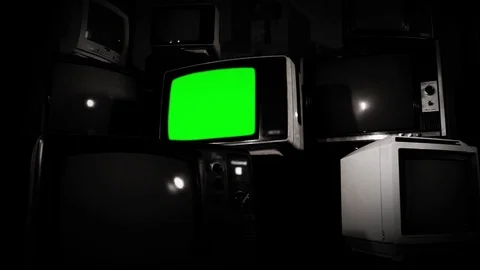 Old Fashioned TV with Green Screen with Many Retro TVs. BW Tone. Zoom Out Fast. Stock Footage 88494079