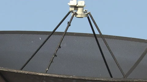 Old fashioned TV satellite dish on house roof for television signals reception 動画素材 149858163