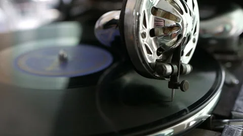 Old fashioned vinyl player. Retro romantic evening with analog music. Stock Footage 128583141