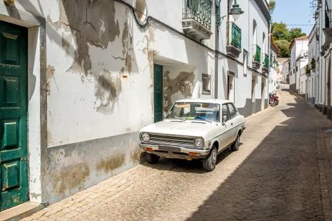 Old-fashioned white car ina village Stock Photos