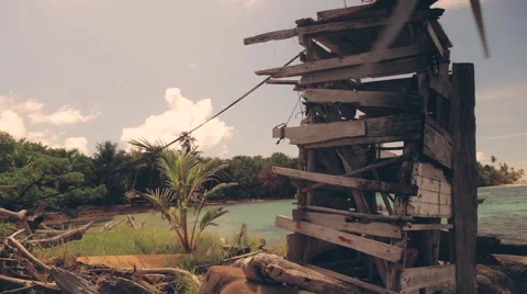 Old fashioned windmill on tropical island Stock Footage 61686038