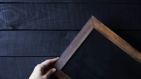 Old fashioned writing slate at wooden table Stock Footage 119123765