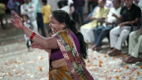 An Old Female Dancing with Radha Krishna during Maharaas function Video stock 130889601