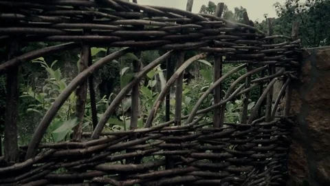 Old fence behind the waterfall Stock Footage 77165398
