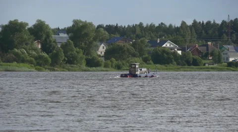 Old ferry crossing river with a car Stock Footage 67599666