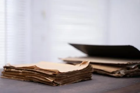 Old file folder with stacks of old and torn papers Stock Photos