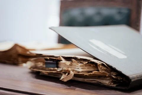 Old file folder with stacks of old and torn papers Stock Photos