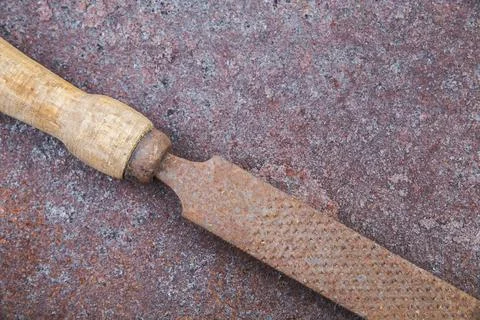 Old file on rusty rough metal surface Stock Photos