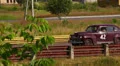 Old film-looking vintage Ford Super Deluxe car on the road HD Footage