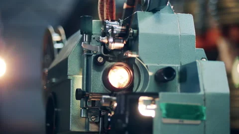 Old film projector is demonstrating a tape movie. Vintage movie, old cinema Vídeo Stock 148816245